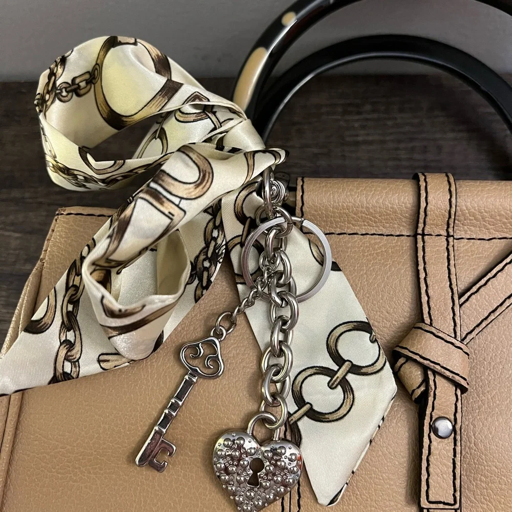 Tan leather tote with acrylic handles by Christine deGennaro